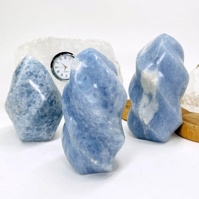 multiple blue calcite flame towers set as home decor 