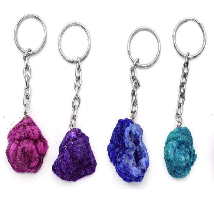 different colored half occo geode silver toned keychain shown against a white background