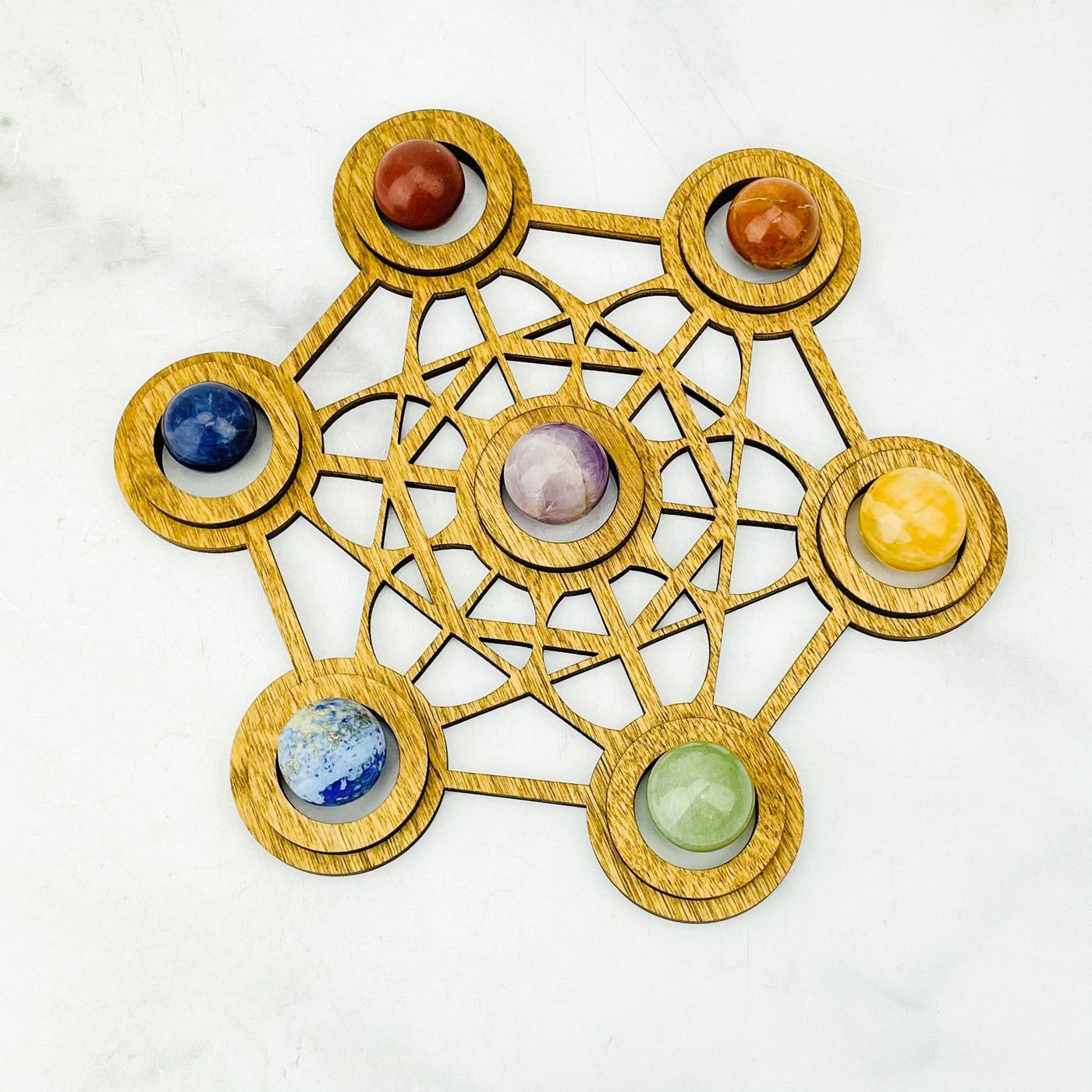 Chakra Sphere Set  on top of a wood grid holder
