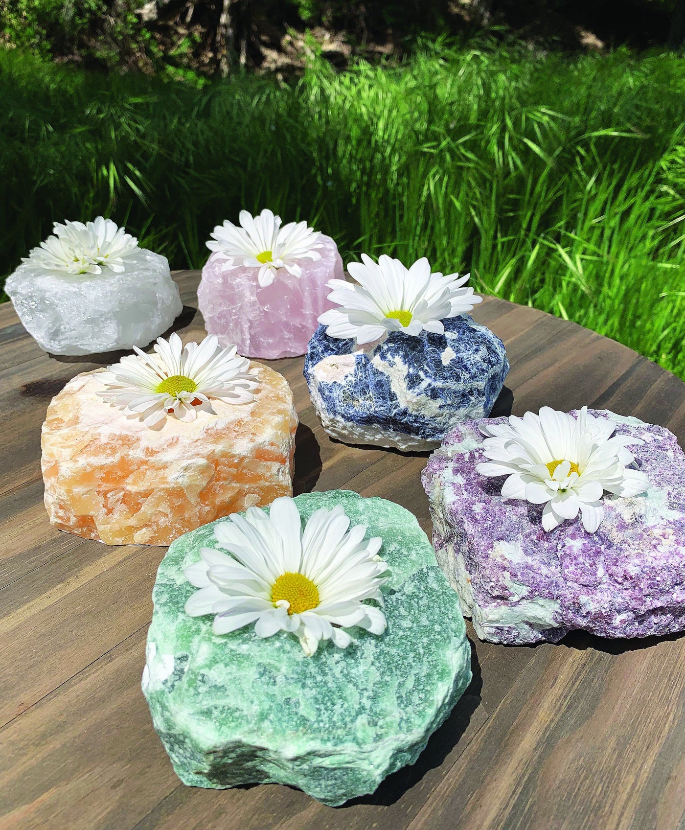 other candle holders that are available on the Rock Paradise website on display with flowers in the candle holder  hole