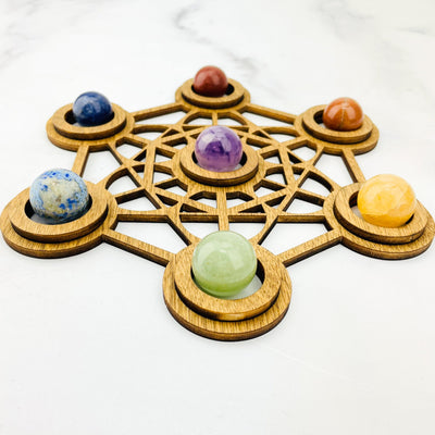 Chakra Sphere Set on top of a wood grid holder