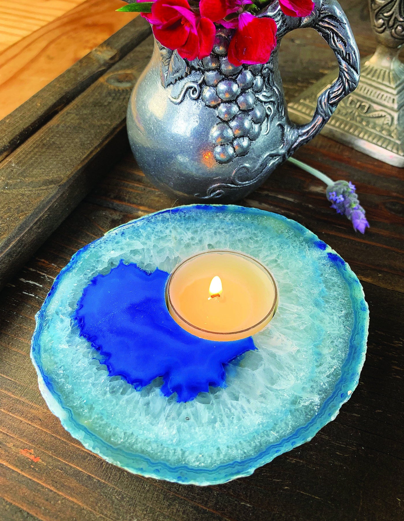 blue agate candle holder with decorations in background