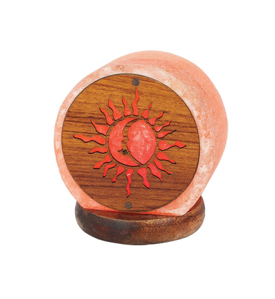 himalayan salt lamp with the sun and the moon pattern in the front 