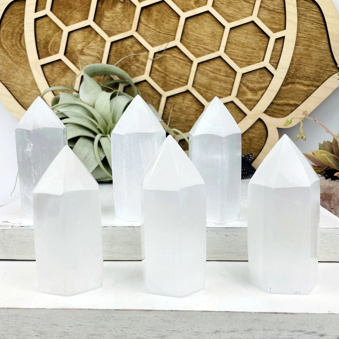 Selenite Tower Points 10CM tall displayed to show variations of hand done