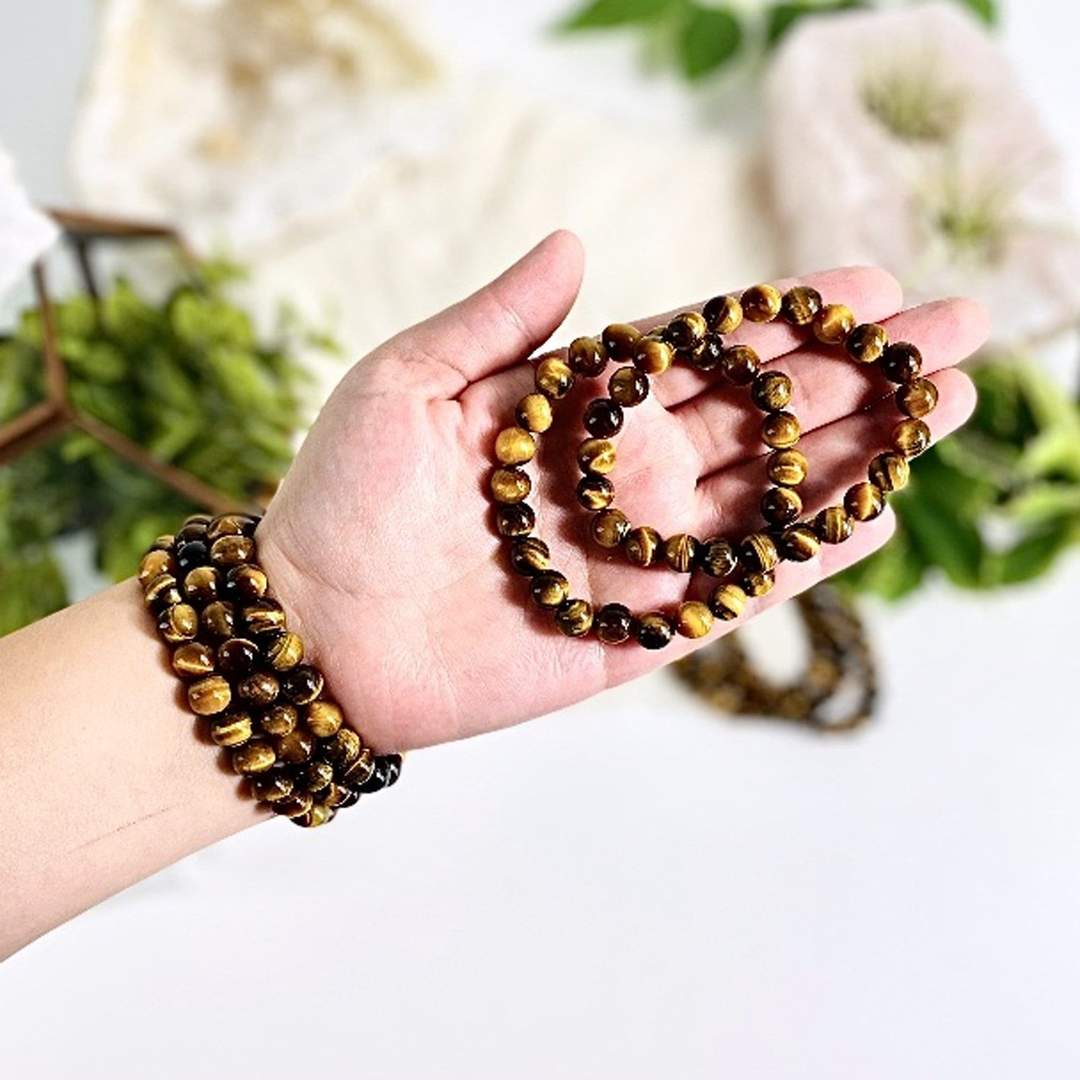 Mala Gemstone Beaded Stretch Bracelets in a hand and on a wrist to show size reference