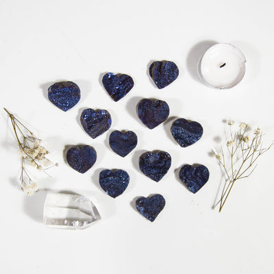 Multiple Mystic Blue Chalcedony Titanium Treated Hearts to show various characteristics of color texture shape size