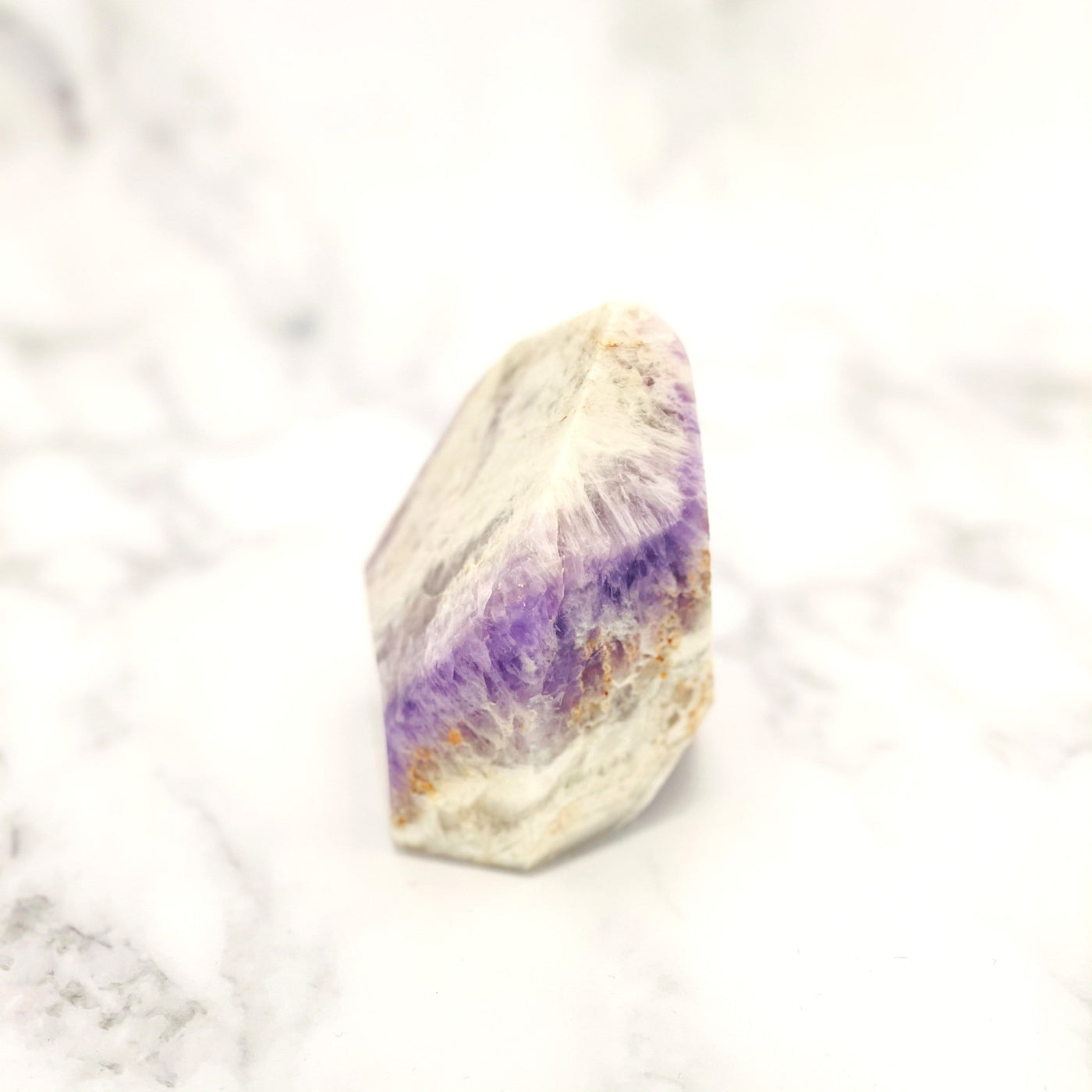 side view of Chevron Amethyst Polished Point