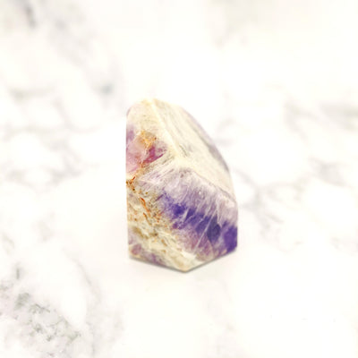 side view of Chevron Amethyst Polished Point