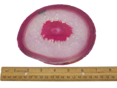This Picture is showing, a size 7 Pink agate slice next to ruler for size reference. 