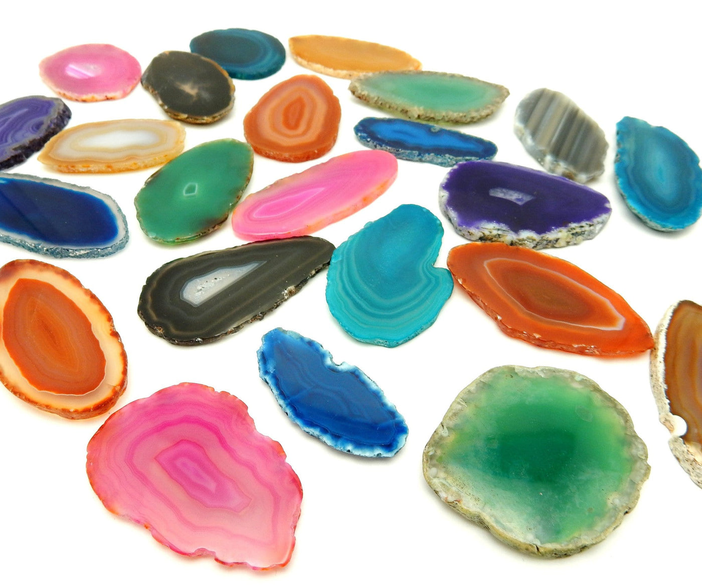 Picture of Multiple color agates size 000, they are also being displayed on a white back ground.