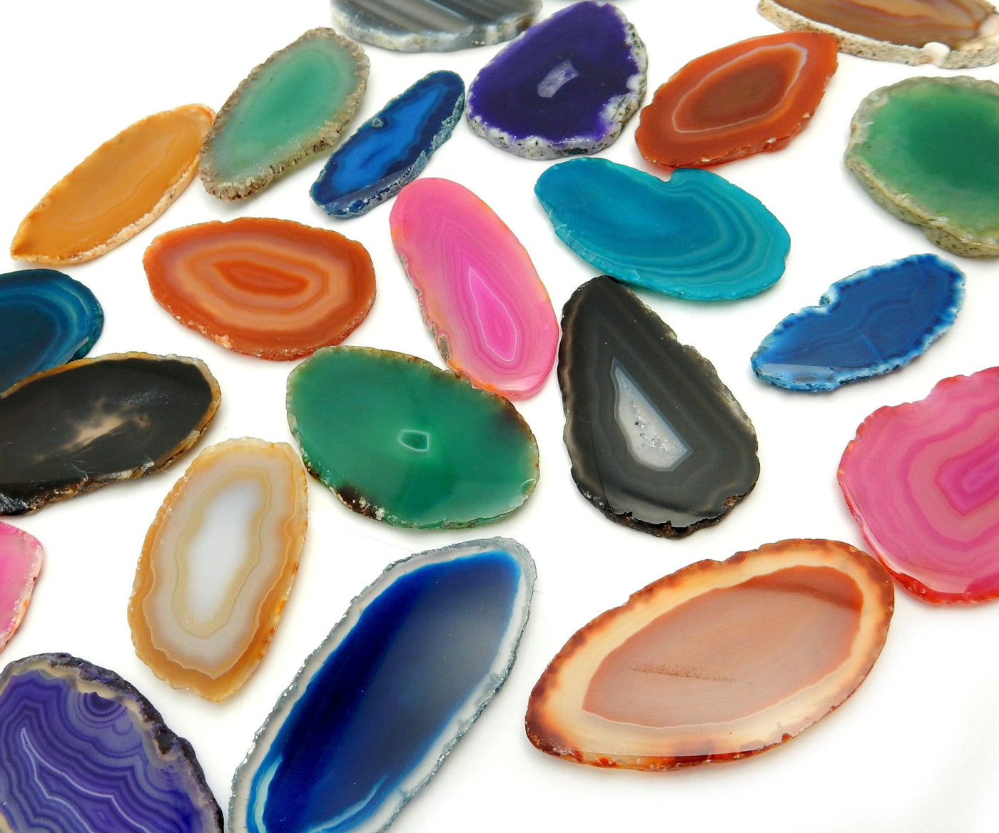 Picture of Multiple color agates size 000, they are also being displayed on a white back ground.