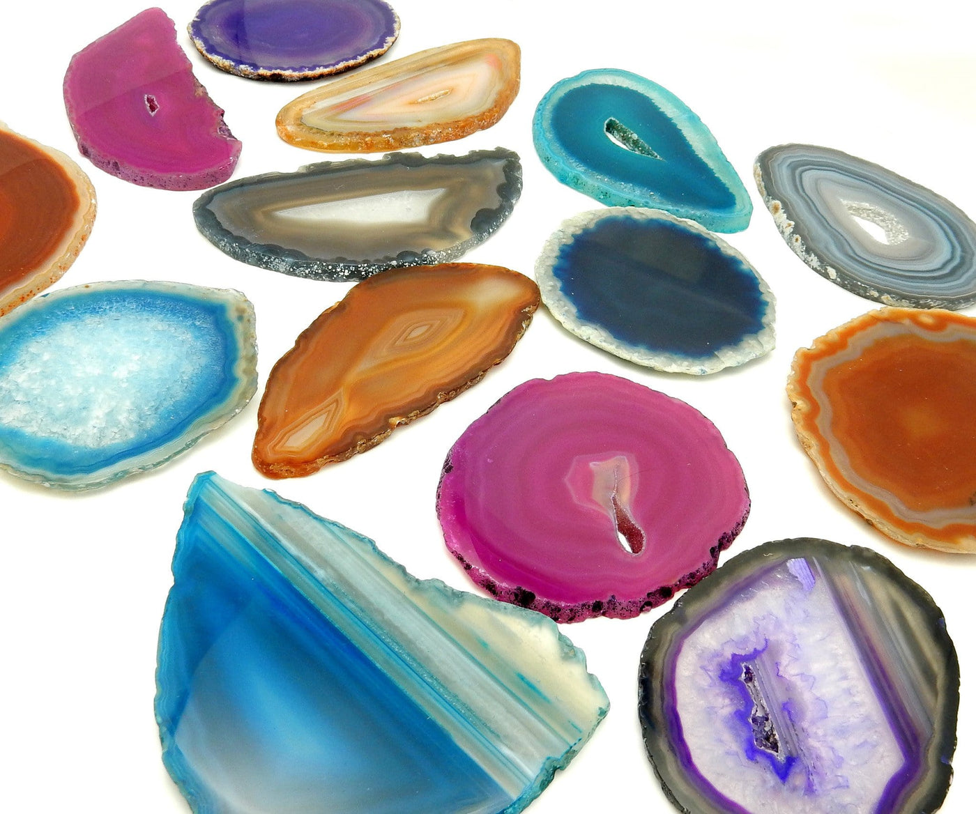 Picture of Multiple color agates size 1, they are also being displayed on a white back ground.
