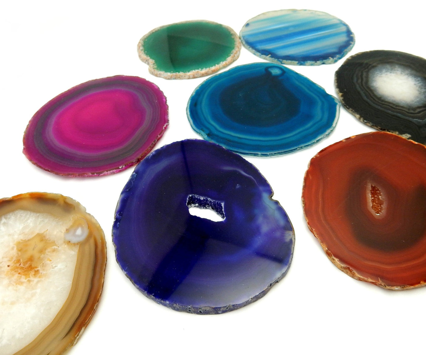 Picture of Multiple color agates size 2, they are also being displayed on a white back ground.