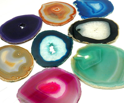 Picture of Multiple color agates size 4, they are also being displayed on a white back ground.