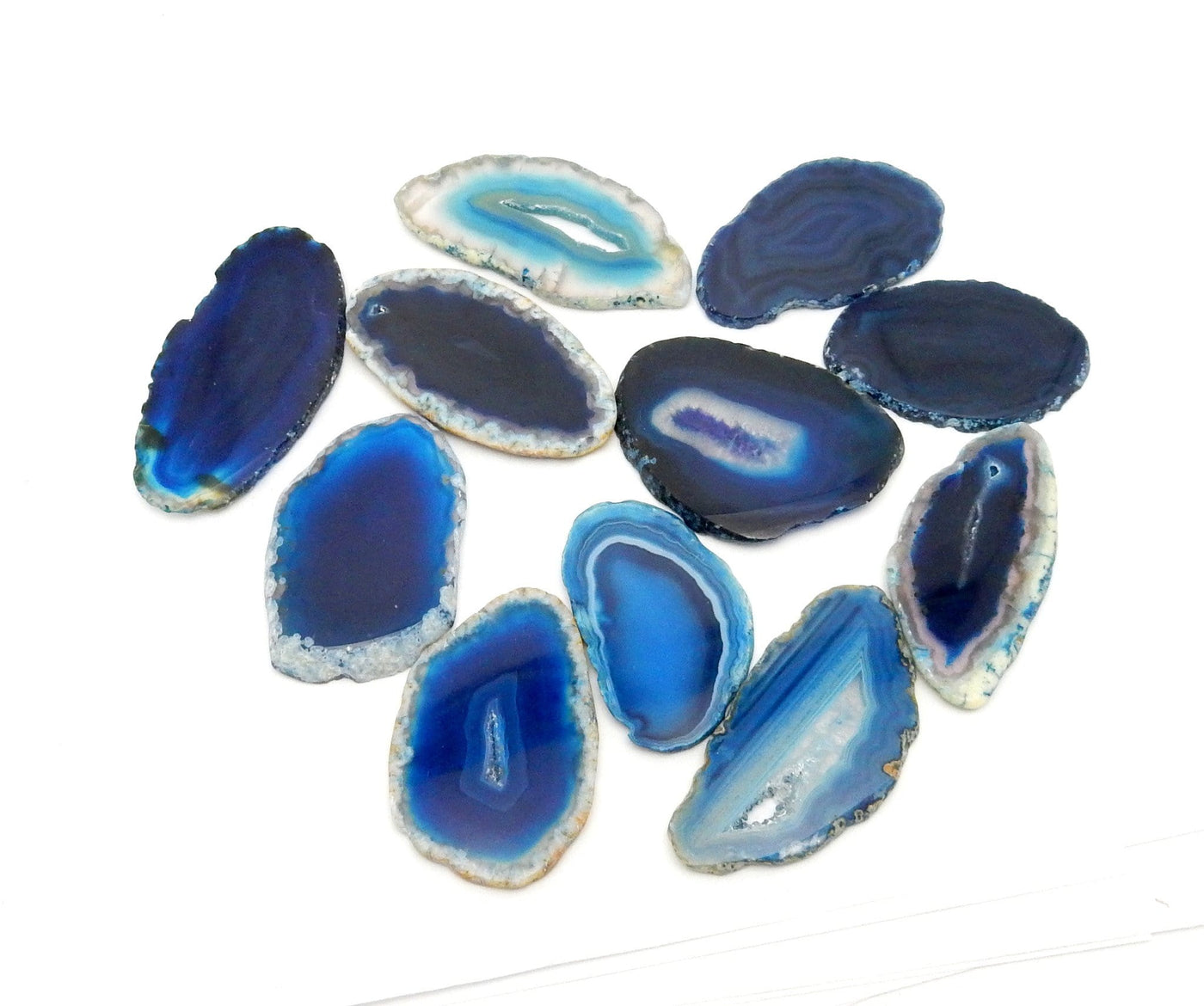 Picture of Blue agate slices on a white back ground.