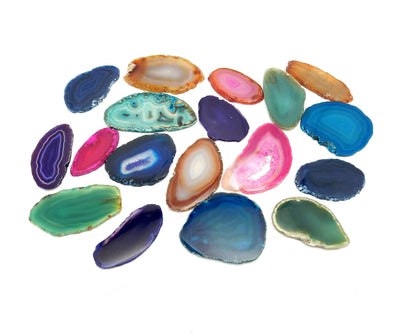 Picture of Multiple agates in different colors on a white back ground for display.