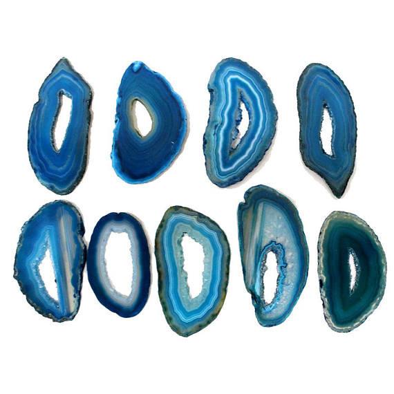 Picture of Multiple blue agate slices extra grade, on white back ground.