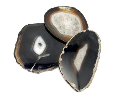 3 Black Agate laid out on white background