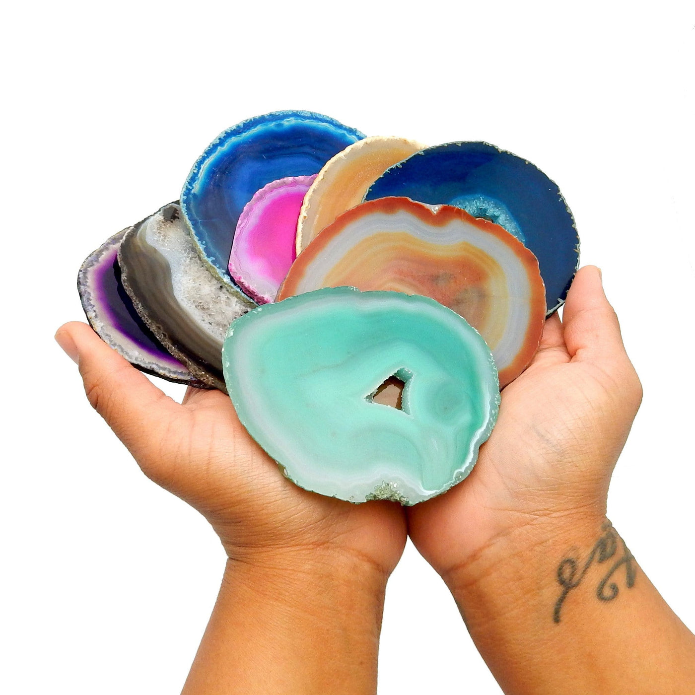 multicolor agate slices in size #4 in hand  colors come in purple black blue pink natural teal orange green