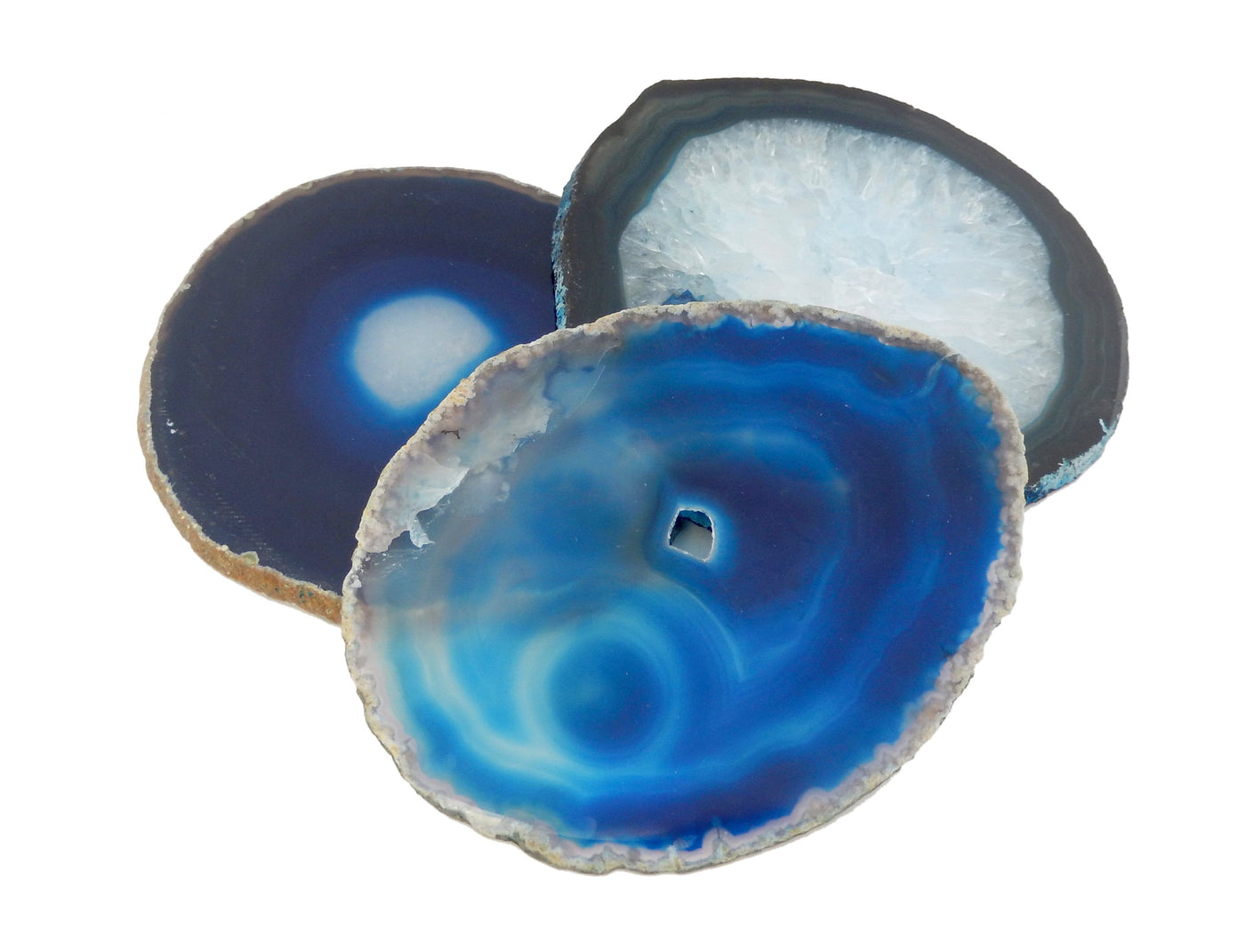 Blue agate slices displayed on white background to show various blue shades