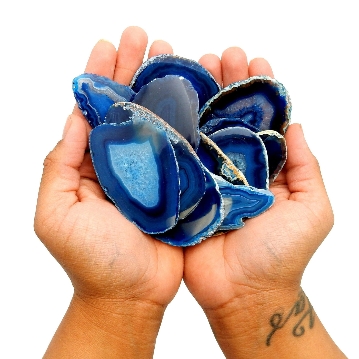 blue agate slices in 2 hands
