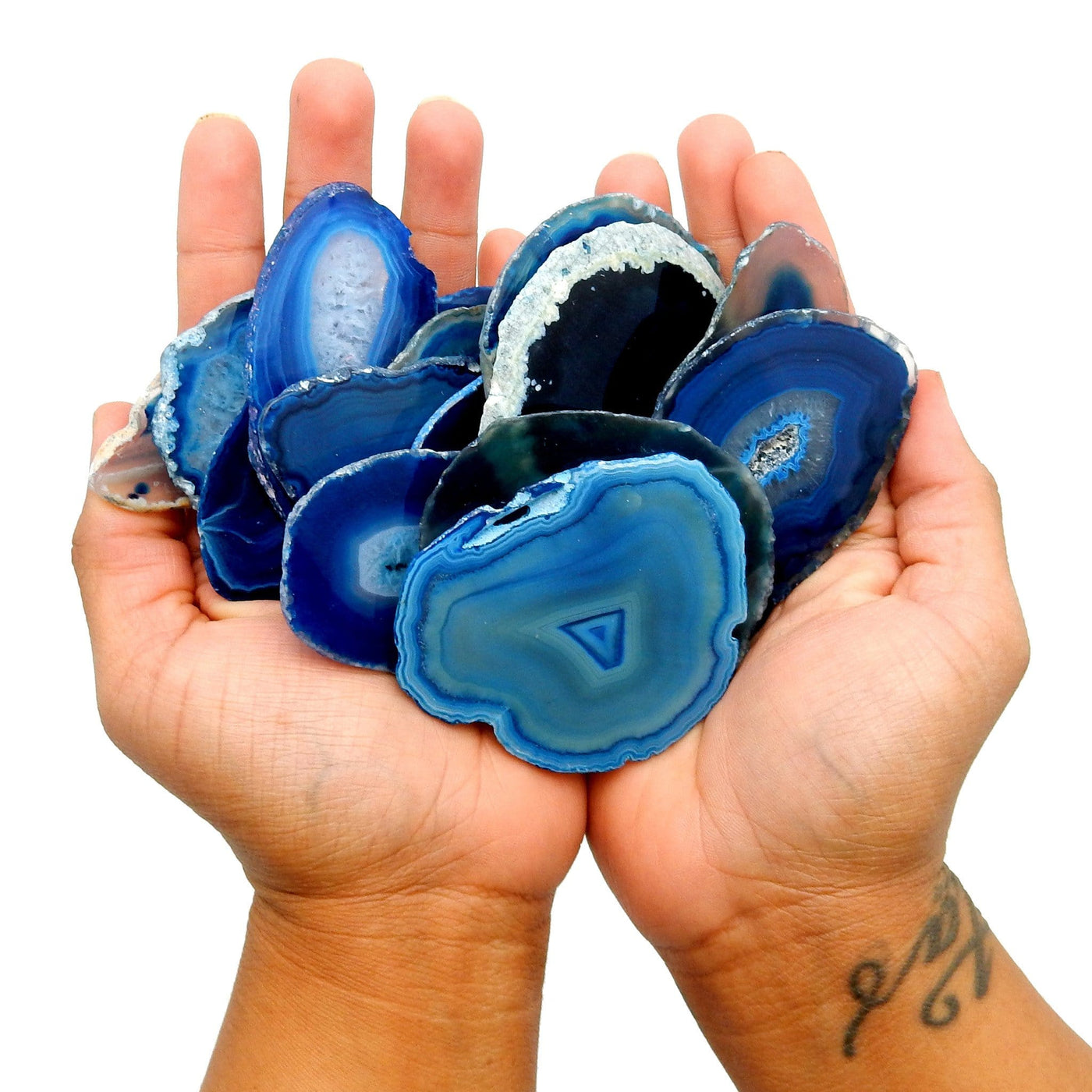 Various Blue Agate Slices placed in cupped hands