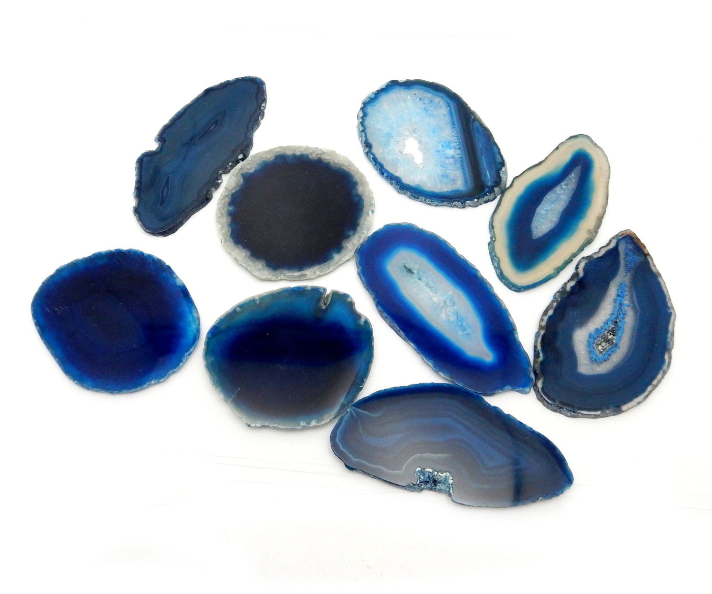 Nine Blue Agate Slices displayed on a white surface.