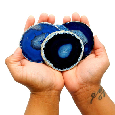 large blue agate slices in 2 hands