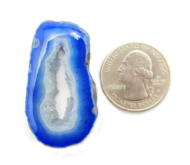 Blue Agate Slices Top Drilled Center Bead Next to a Quarter To Shown The Size on White Background. 