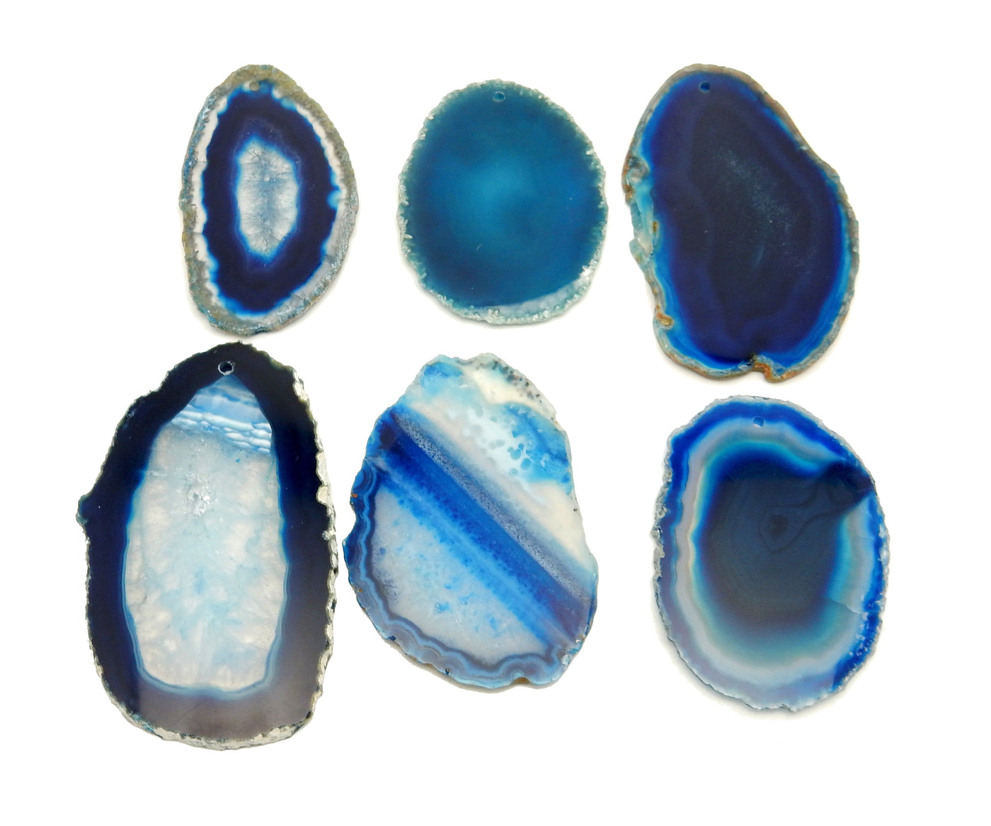 6 Blue Agate Slices Drilled on White Background.