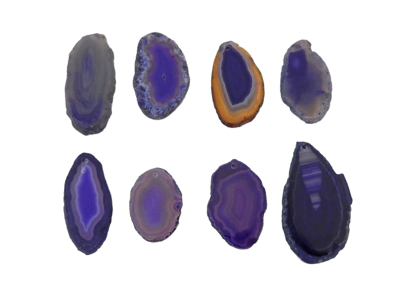 8 Purple Agate Slices Drilled on White Background.