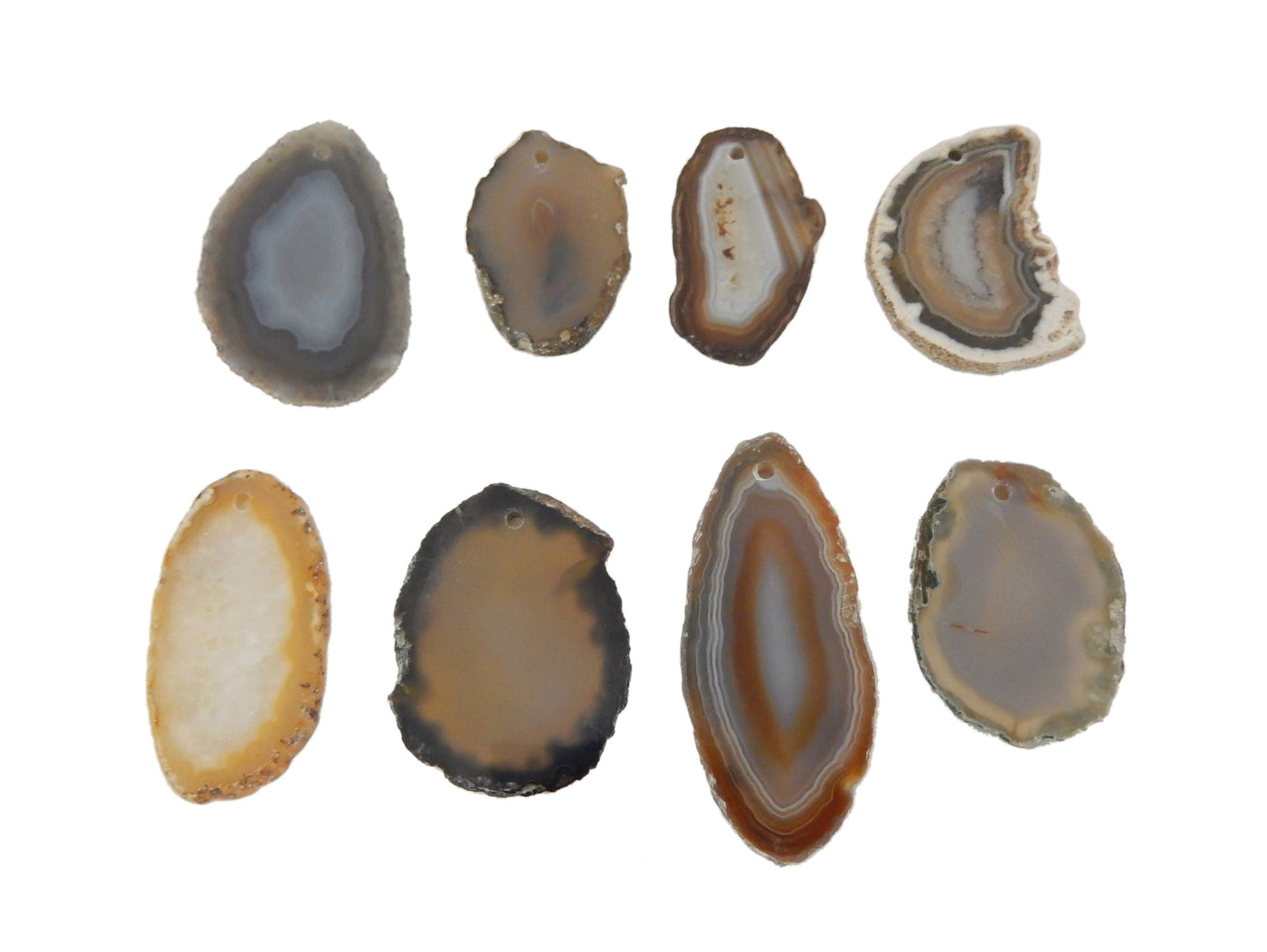 8 Natural Agate Slices Drilled on White Background.