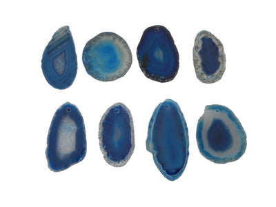 8 Blue Agate Slices Drilled on White Background.