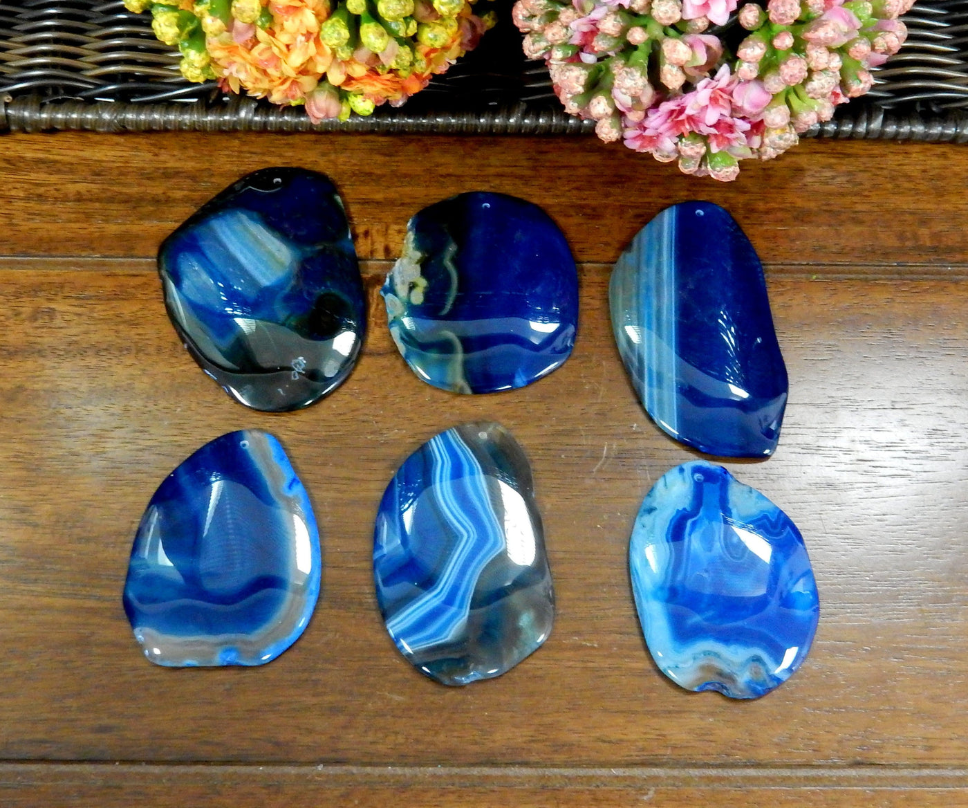 6 Blue FreeForm Agate Slices with Polished Edge on Wooden Background.