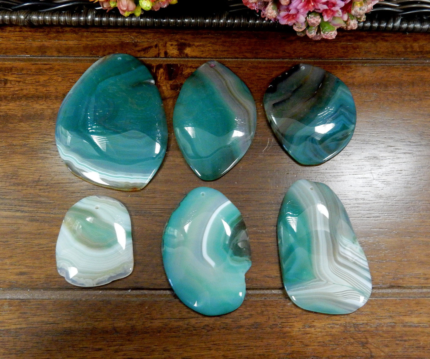 6 Green FreeForm Agate Slices with Polished Edge on Wooden Background.
