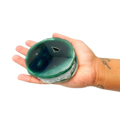 large green agate slices in a hand