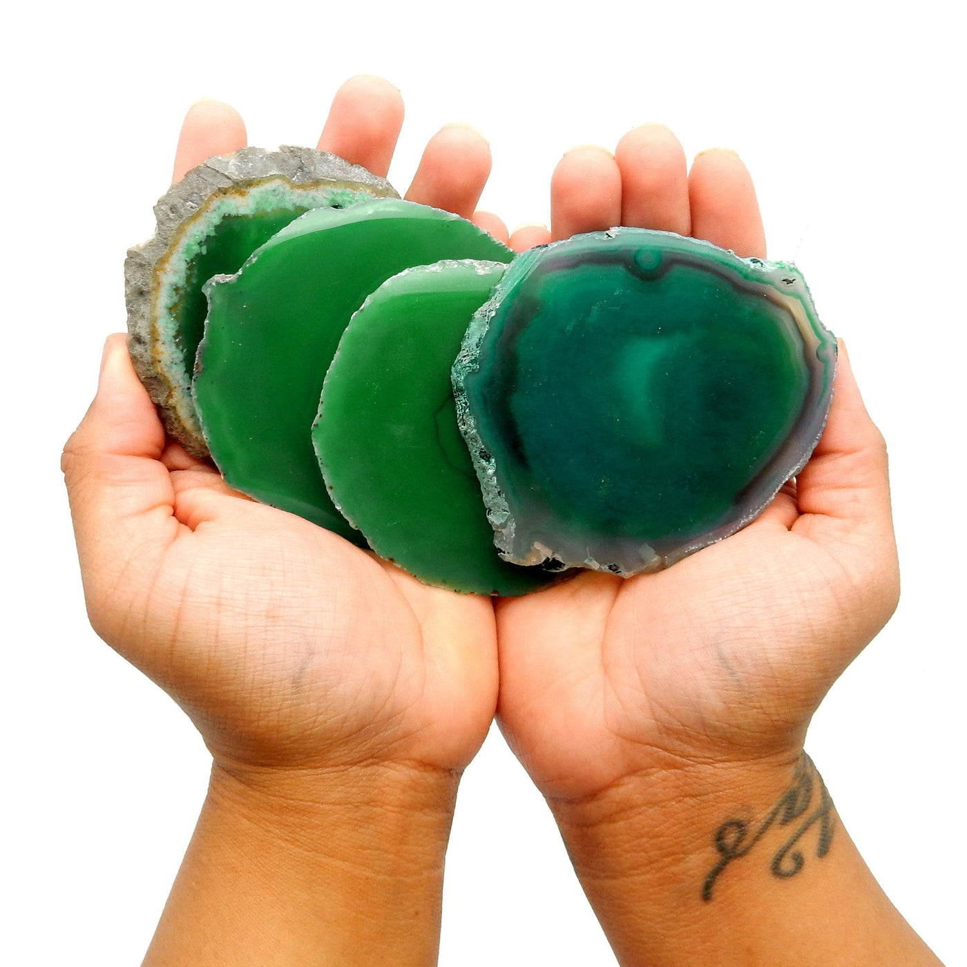 green agate slices in hand for size reference 