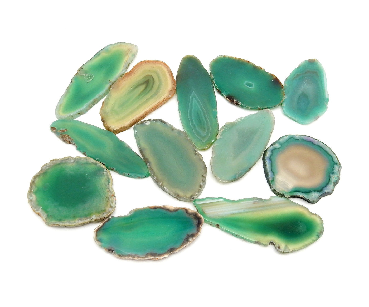 Agate Slices - Green Agate Slices - a bunch scattered on a table