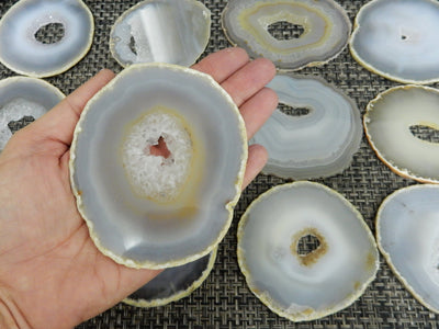 Natural Agate Slices - Extra Grade Polished Agate - Coaster Size with Open Druzy Center in a hand