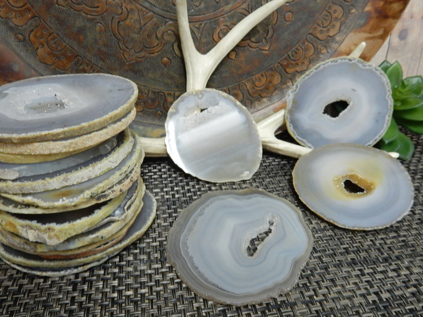 Natural Agate Slices - Extra Grade Polished Agate - Coaster Size with Open Druzy Center - a bunch stacked  and 4 on display