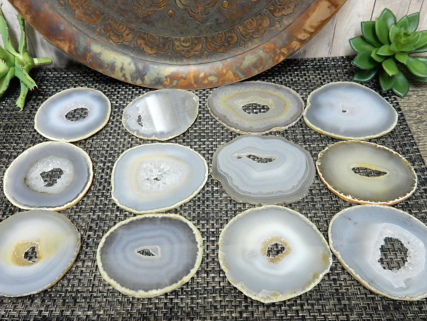 Natural Agate Slices - Extra Grade Polished Agate - Coaster Size with Open Druzy Center -  3 rows of 4 laying on a table