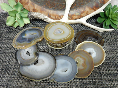 Natural Dark Agate Slices - a pile of them and 7 stacked around them