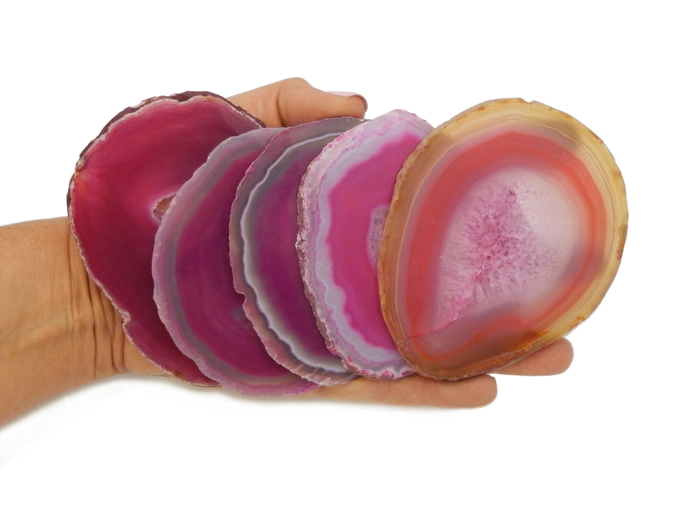 Pink Agate Slices in a hand