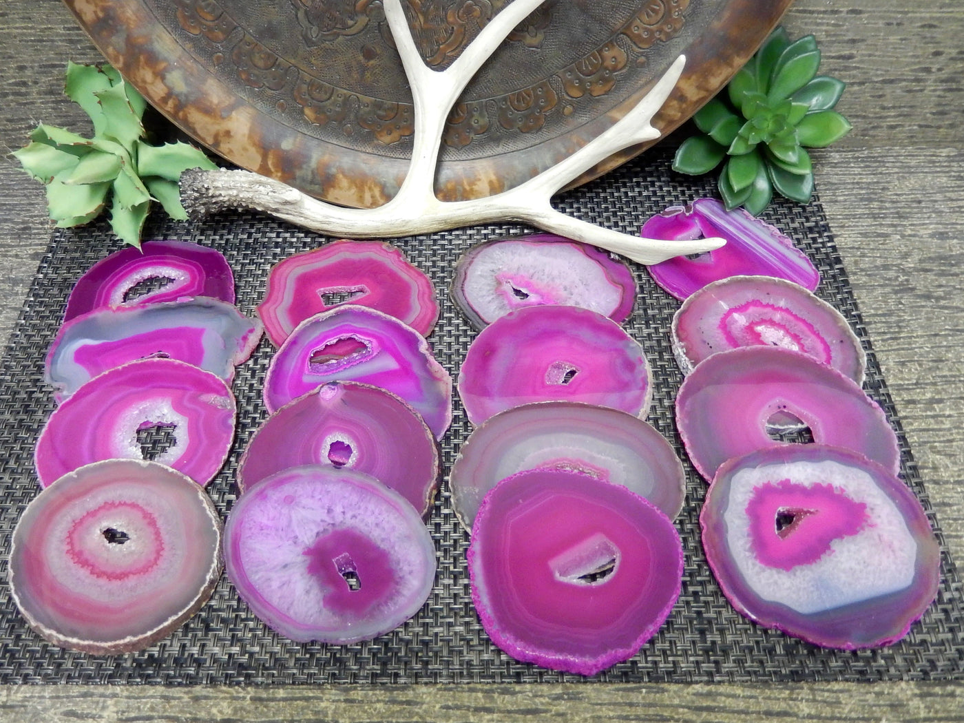 pink agate slices lined up on a table