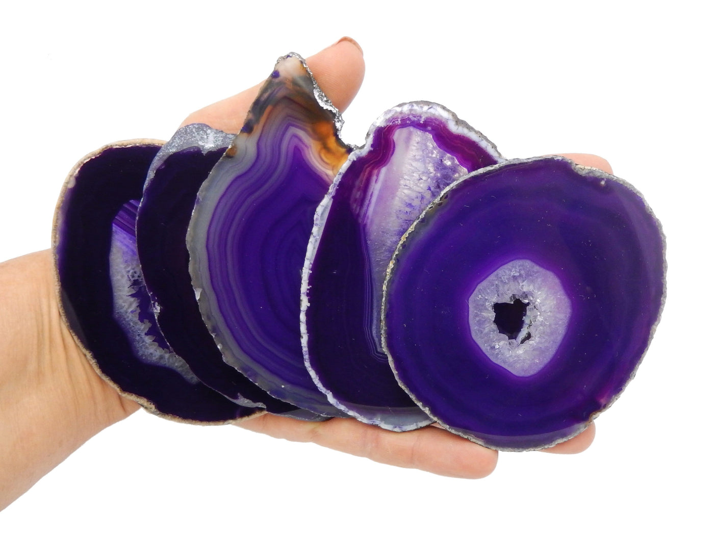 Purple Agate Slices size number 3 displayed in hand to show size reference