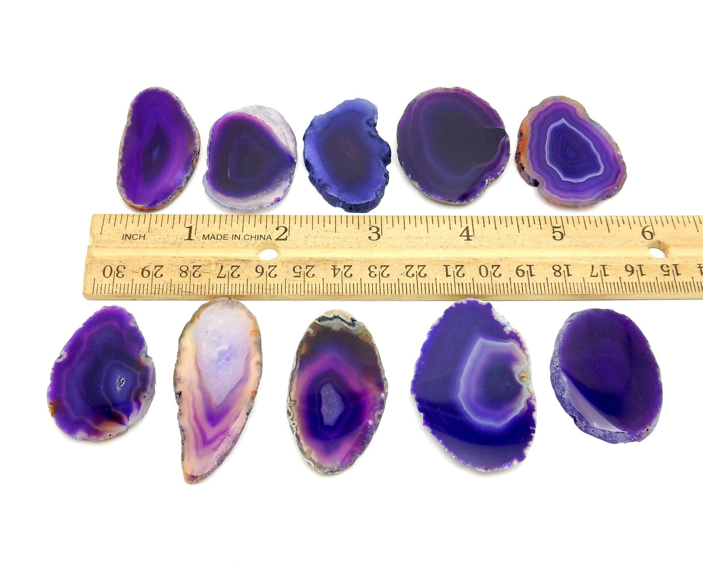 Purple Agate Slices - Size 000 - next to a ruler for size reference