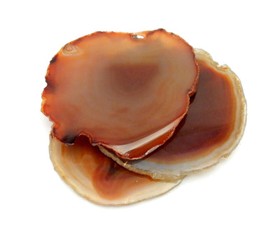 3 Red Agate Slices stacked on top of each other on white background