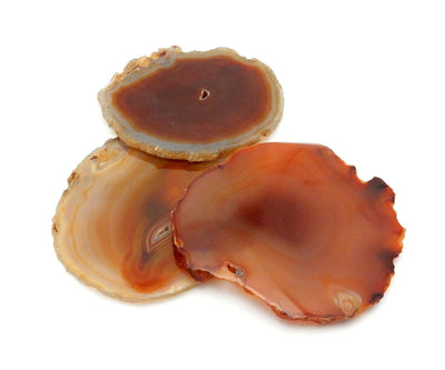 3 Red Agate Slices on white background