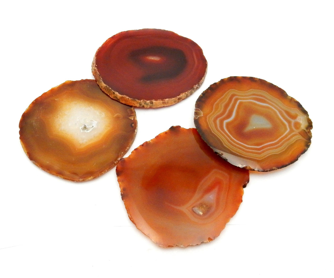 4 Red Agate Slices on white background