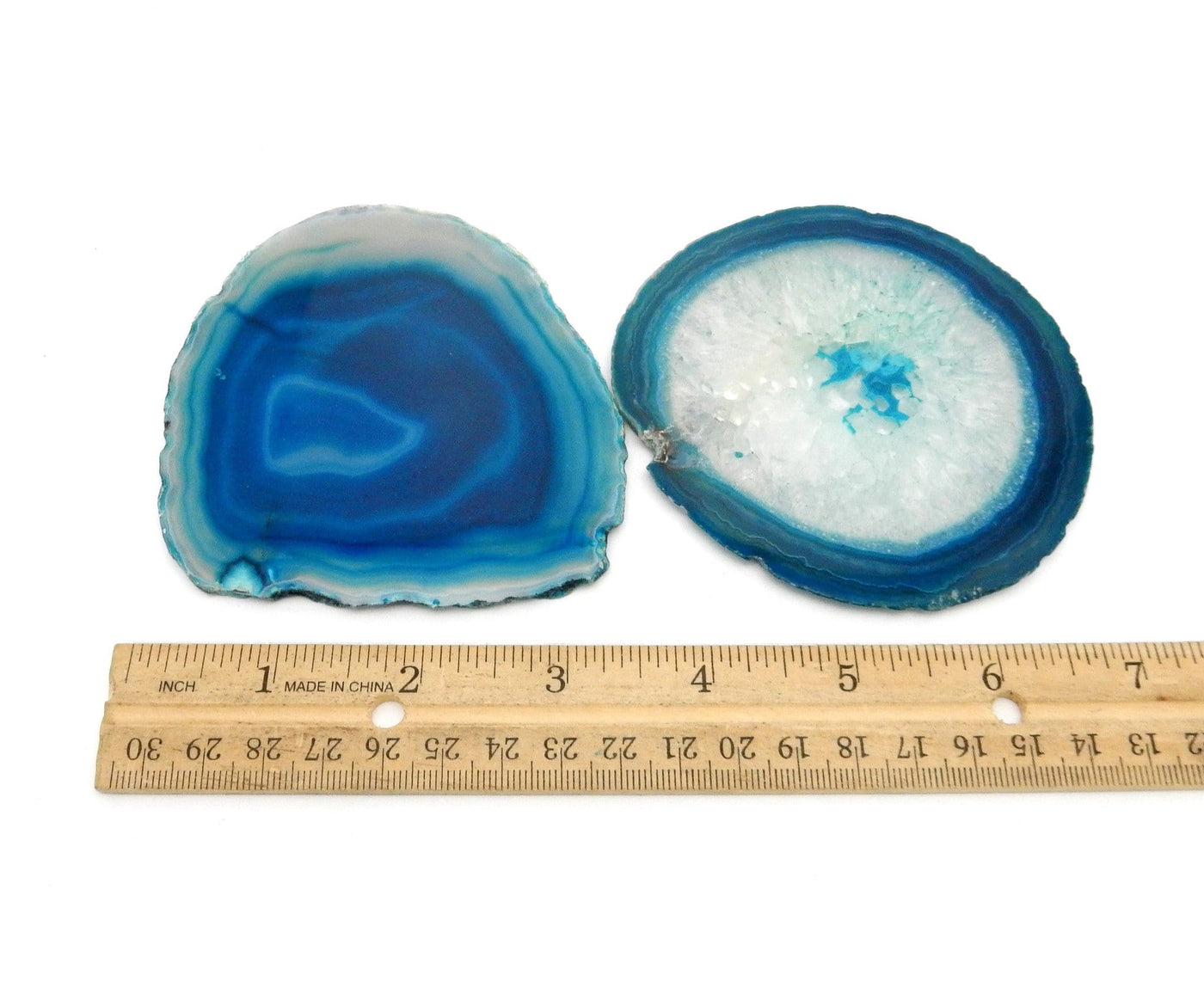 2 Teal Agate Slices in a Size number 2 next to a ruler for sizing